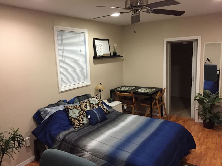 Full size bed with night stand, alarm clock.