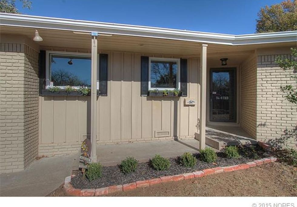There are stairs leading to the front door.