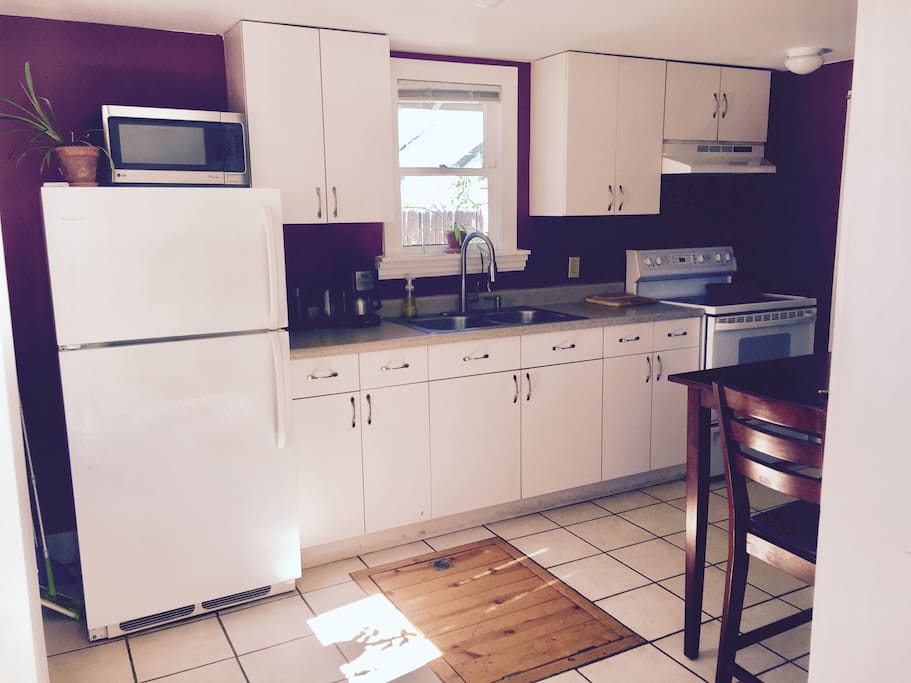 The kitchen is well lit and spacious.