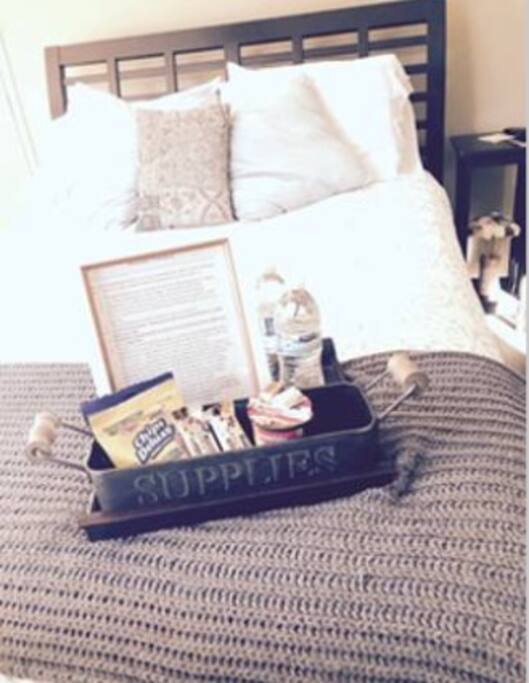 Queen sized comfy bed with luxurious linens complete with traveler treats which greet you upon arrival