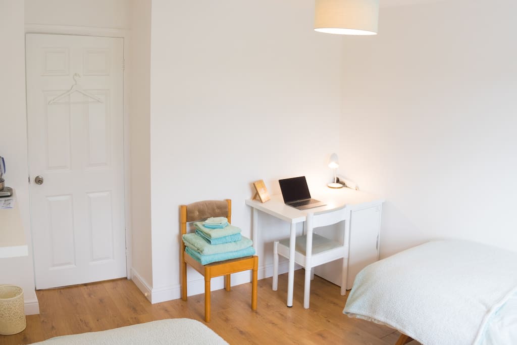 Twin bedroom laptop friendly space