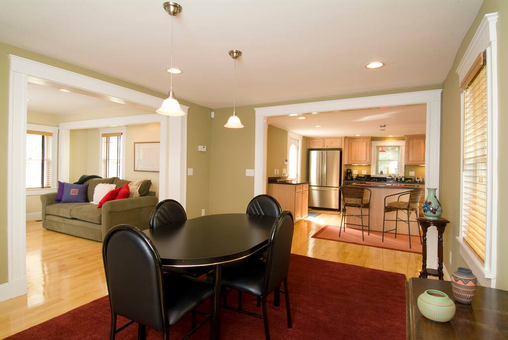 Dining area with view into living room and kitchen