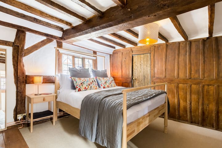Master Bedroom with 16th century wooden panelling and 4 poster style king size bed. 