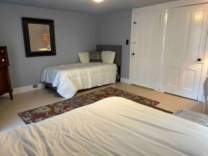 Bedroom 1: A full bed and a single daybed.