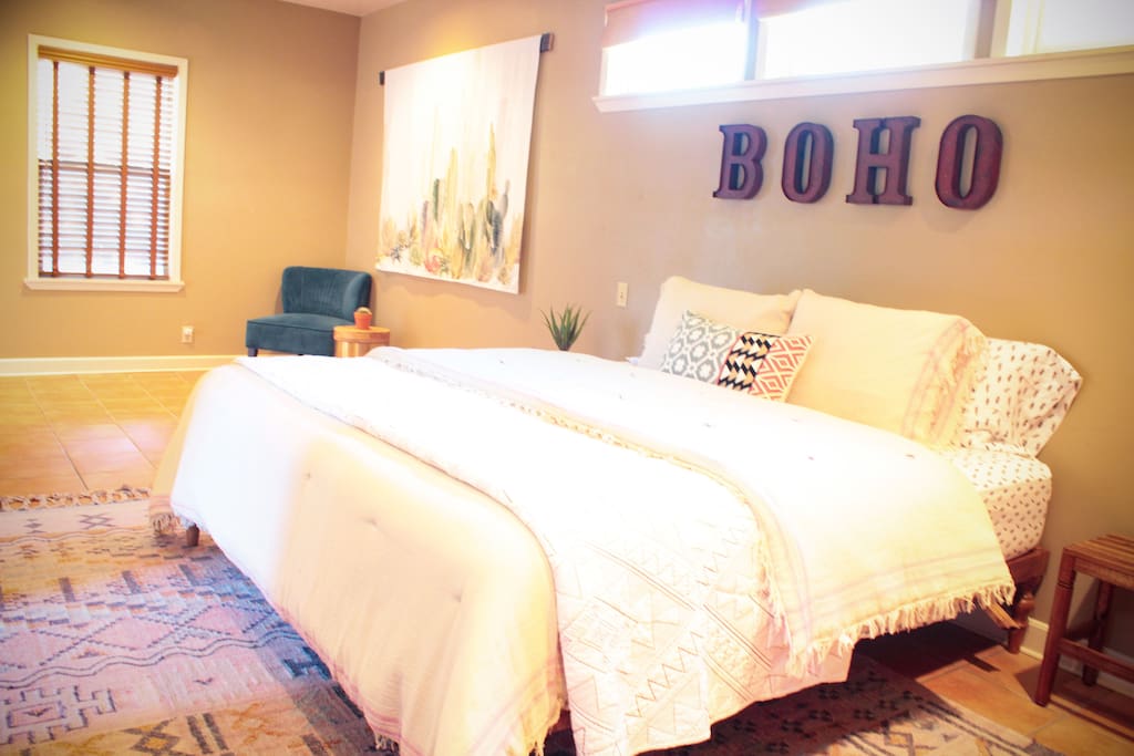 Master suite with king size bed and TV.