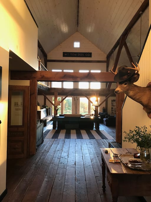 View through the barn from kitchen to the west facing 1500 sq ft great room.