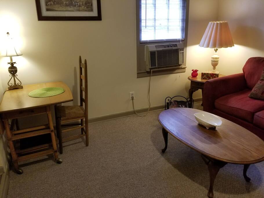 The dining area is in the corner of the living area. The table itself can be rolled and the leaf lifted for more seating room. Additional placemats are in the kitchen.