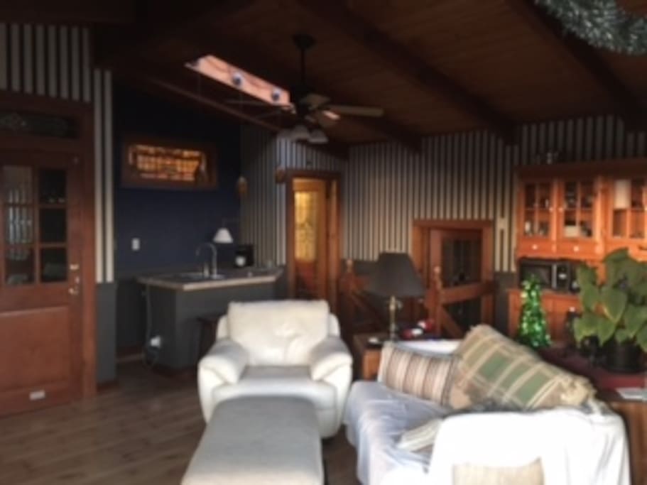 Great room has a wet bar with fridge and a pull-bed for third guest