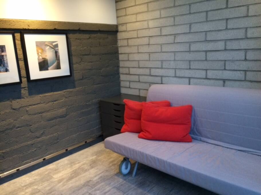 Comfortable double bed is made up from fold-out couch.