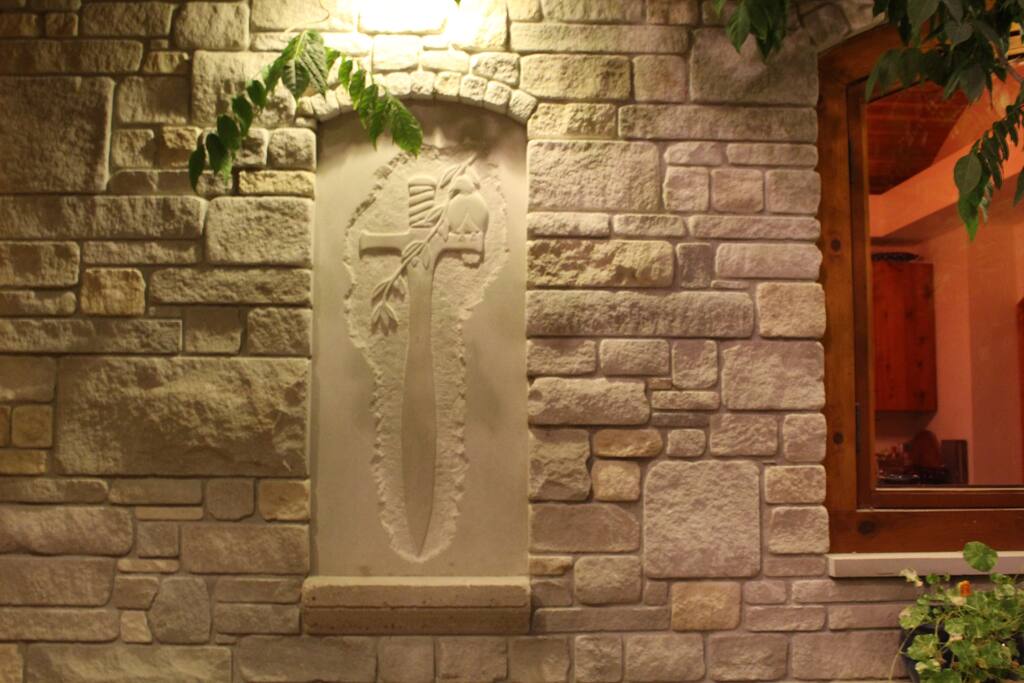 Carving by Greg: Peace over the sword.