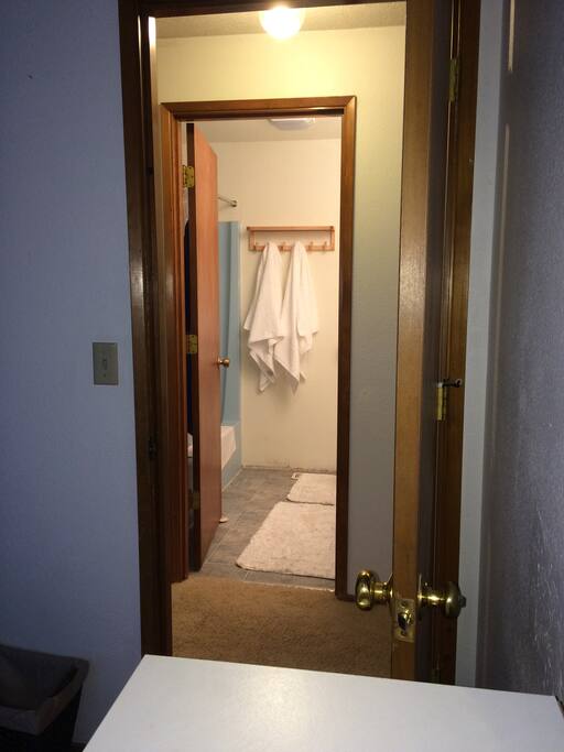 Shared guest bathroom across hall.