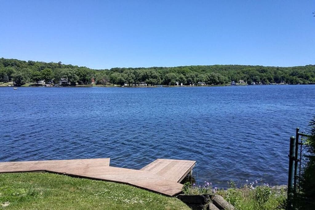 Private dock for launching canoes, kayaks or just relaxing. Accessible from a grassy path just steps from the front porch.