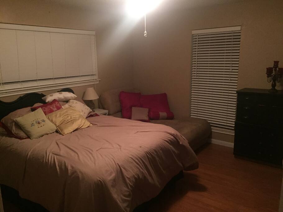 1st bedroom with dresser and closet space