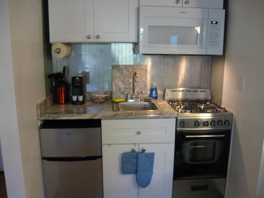 Full Gourmet kitchen with coffee maker, microwave oven, gas stove with conventional oven, an under counter refrigerator freezer and all the necessities to prepare your favorite meals.