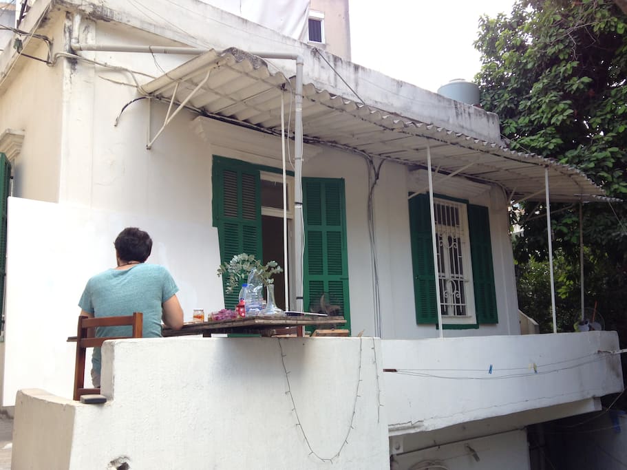 The house has a private roof and balcony with an avocado tree.