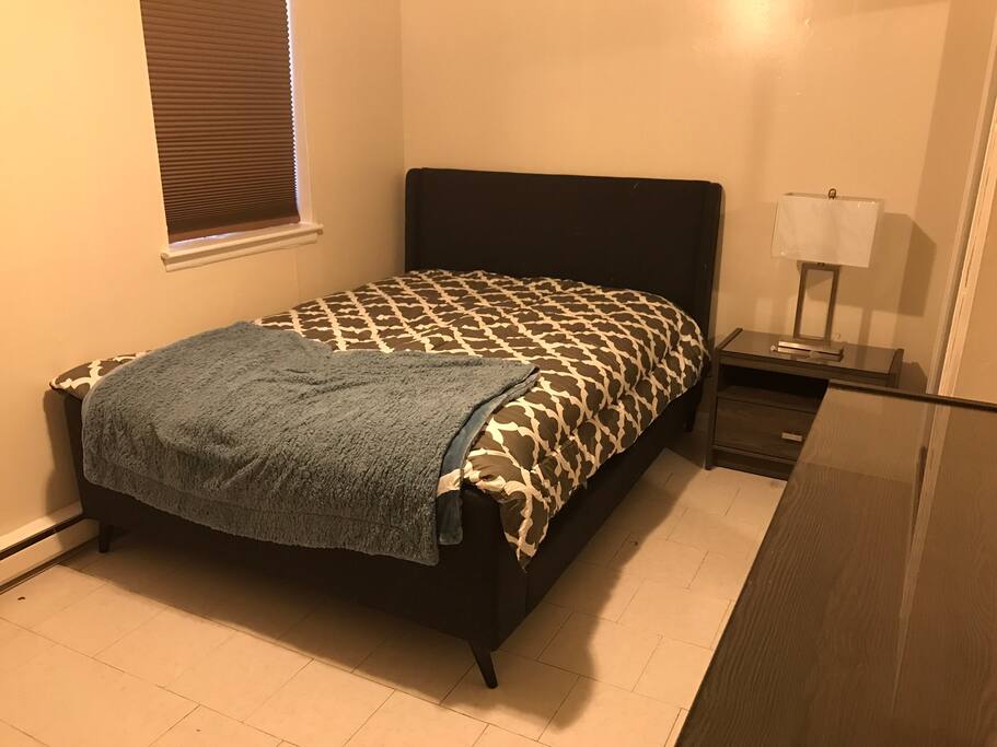 Master bedroom of the apartment. You'll need to bring your own pillows.