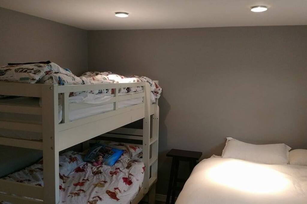 Bedroom: single bunks plus a queen bed