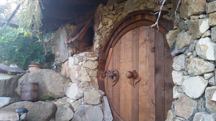Custom built, classic “hobbit-style” round-door, made of Western Red Cedar, featuring one-of-a-kind locking system in real-life Hobbit House near San Diego, CA