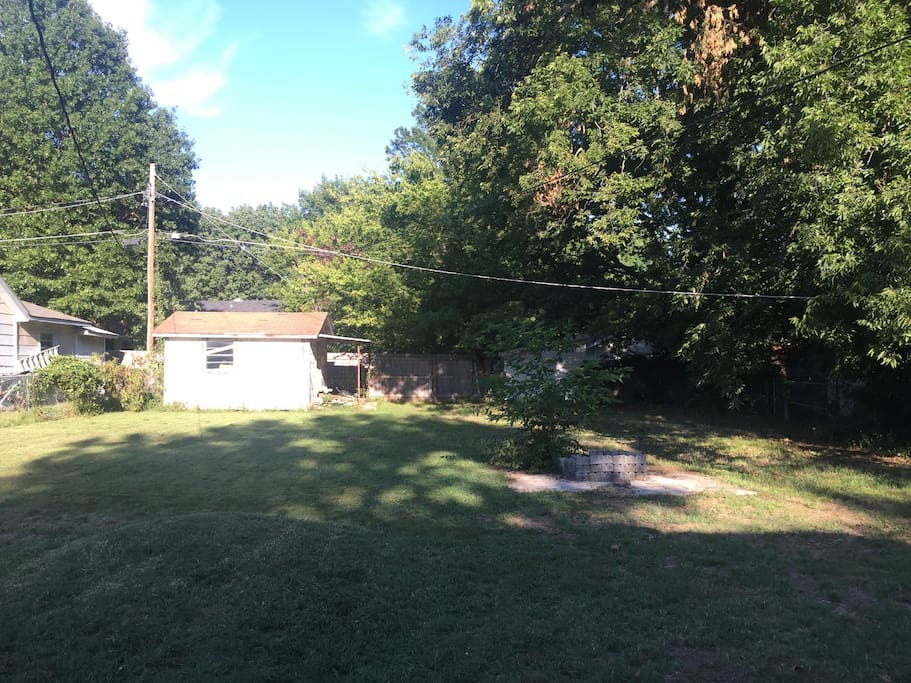 The backyard, perfect for throwing around a frisbee, playing tag, or lying in the grass and looking at the clouds...
