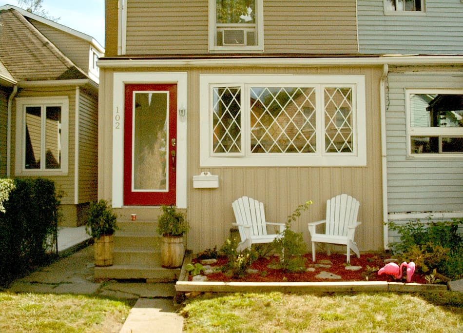 Front of the house including porch room windows and entrance plus muskoka chairs and rose garden directly in front. You are welcome to use them.