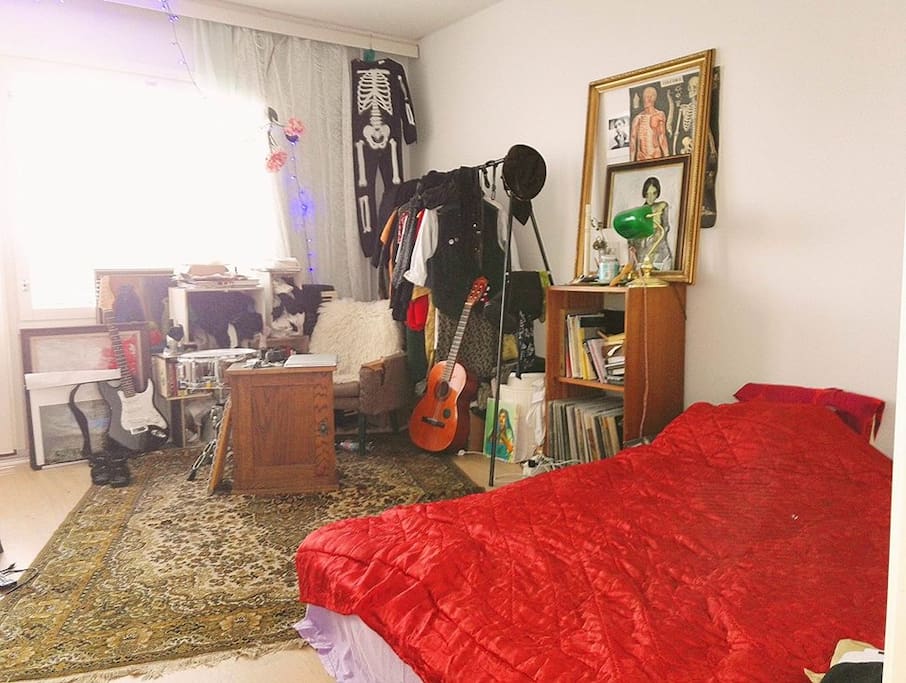 Bedroom number two has a balcony and a queen size bed.