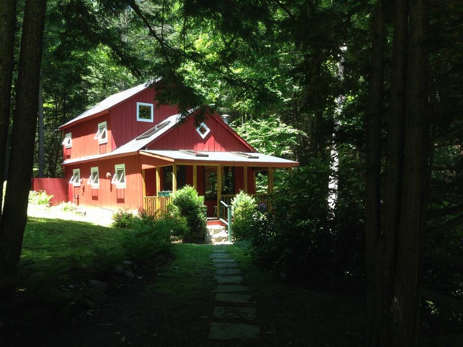 The cabin has very large windows on the waterfall side that bring in nature.