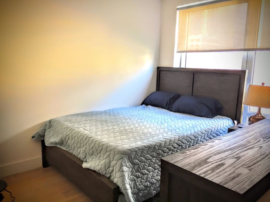 Bed and dresser conveniently tucked away for a peaceful night in.