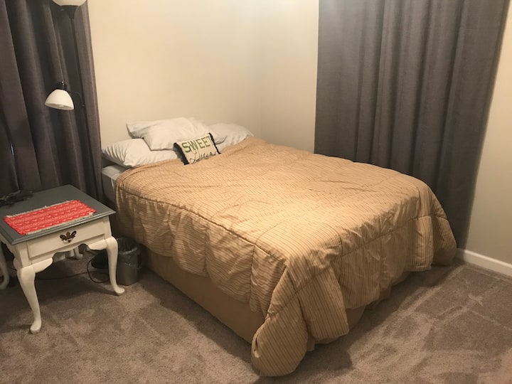 Guest Bedroom with a full bed and blackout curtains