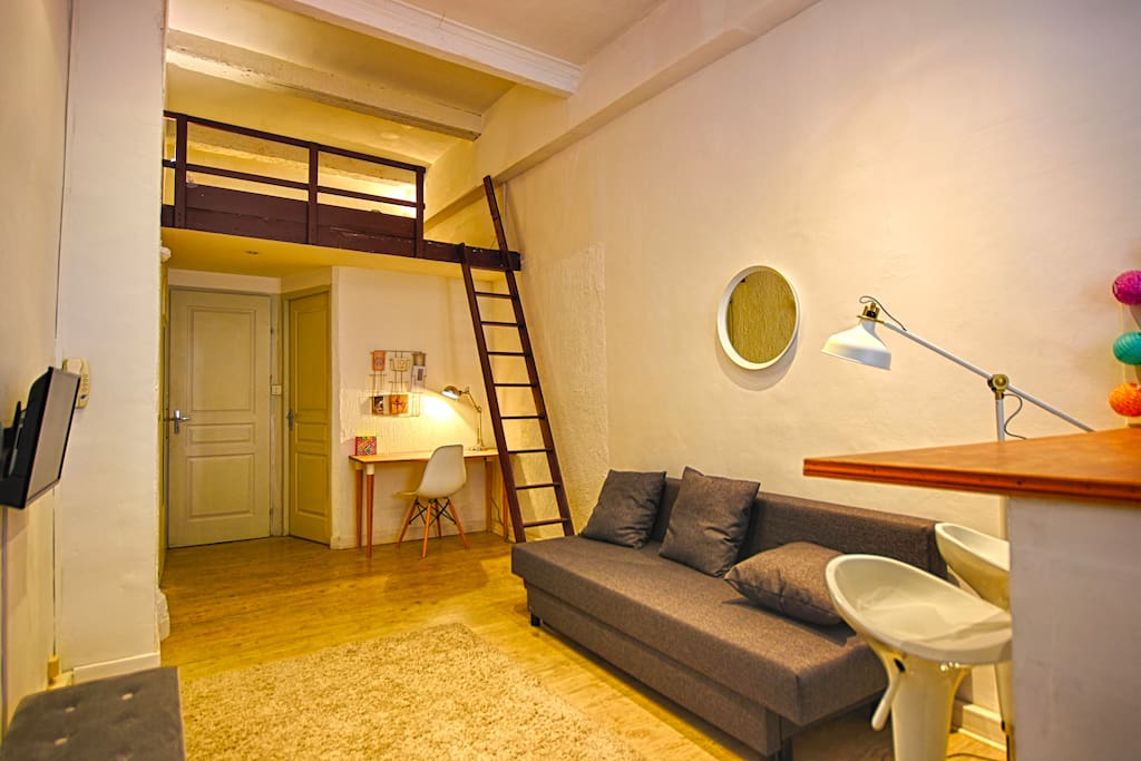 Séjour avec lit en mezzanine