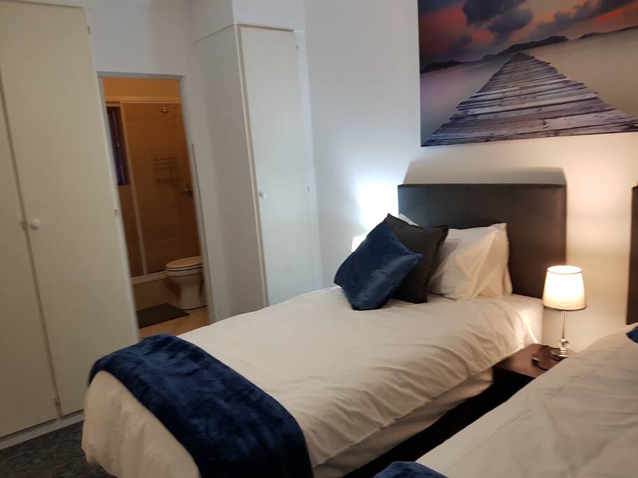 This room can be set up with 2 single beds or 1 king size bed depending on guest requirements.