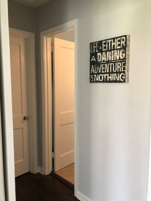 Hallway leading to your room. Bathroom door open