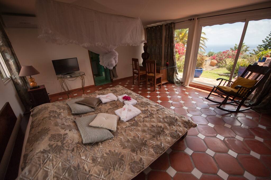 big bedroom with direct view of the sea from the bed