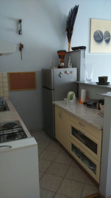 Kitchen is within living room