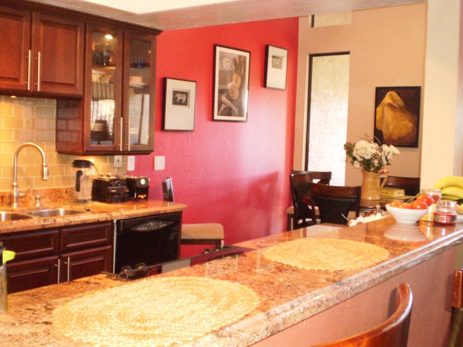 Breakfast bar, dining room and kitchen.