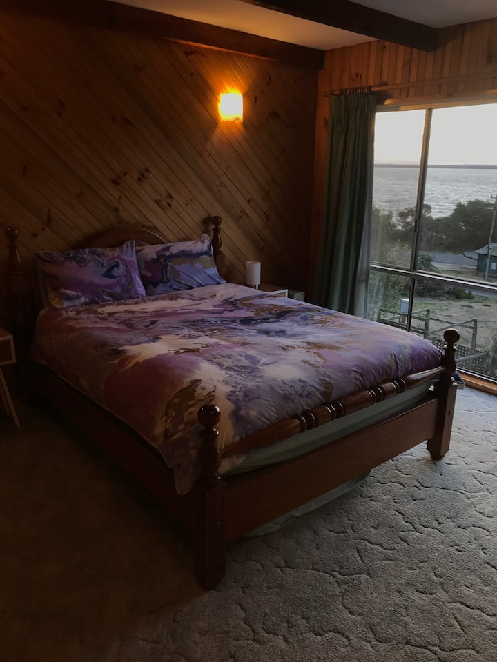master bedroom with view , spare single mattress under bed  
