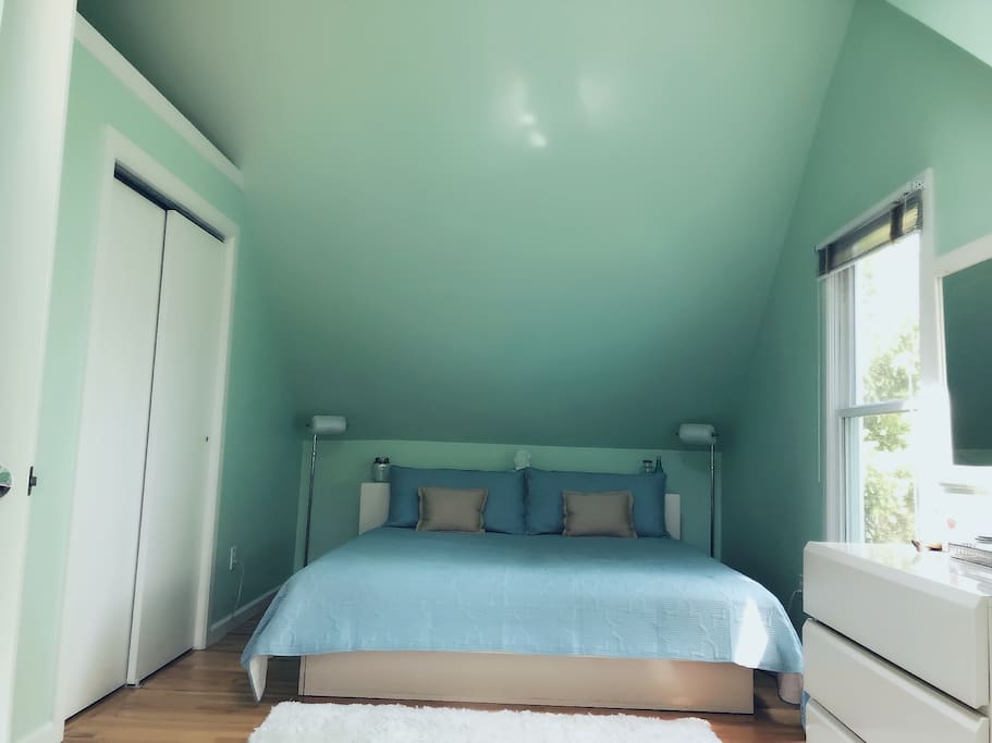 spacious bedroom with king sized bed