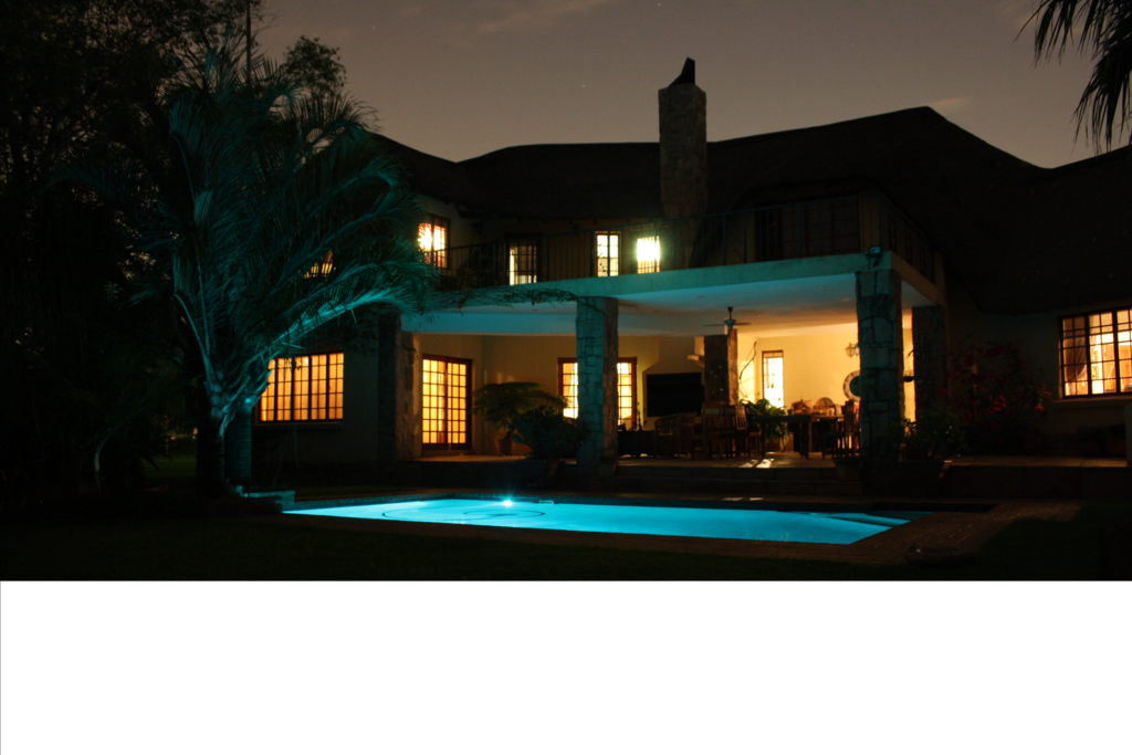 View of main house and pool at night