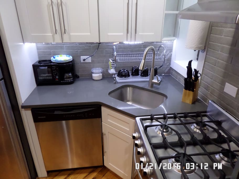 Kitchen with LED lights under the cabinet.