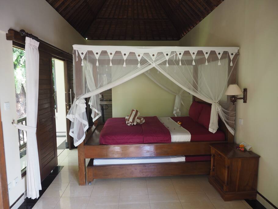Bed with mosquito net