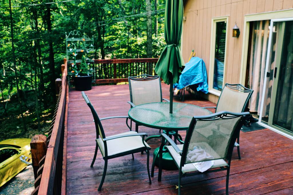 Large deck with patio table, additional foldable table available to seat 13