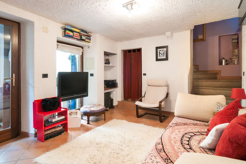 Television and stairs to the upper floor