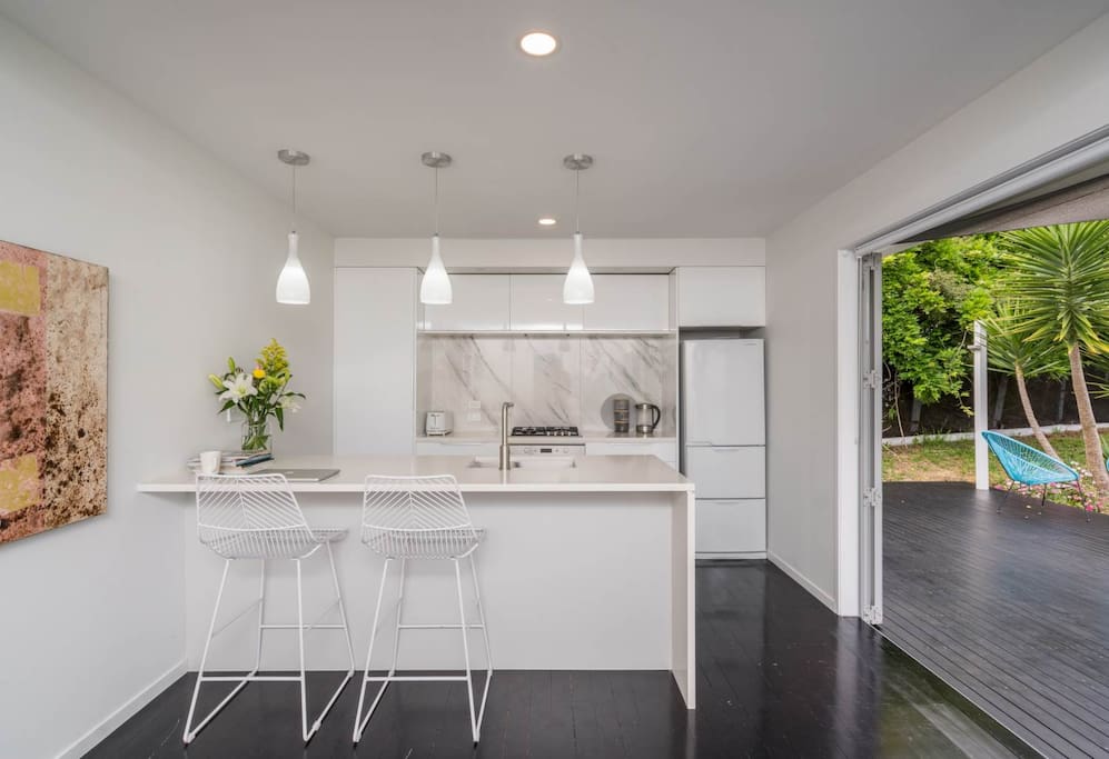 Relax and unwind with open plan living and dining areas - watch TV or just open the big doors and listen to the birds singing or enjoy a cup of coffee on the patio. Indoor and outdoor dining options, plus a breakfast bar