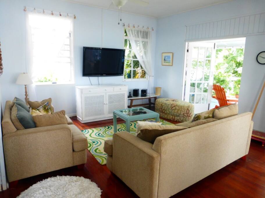 Cool comfortabel living area with large flat screen tv.