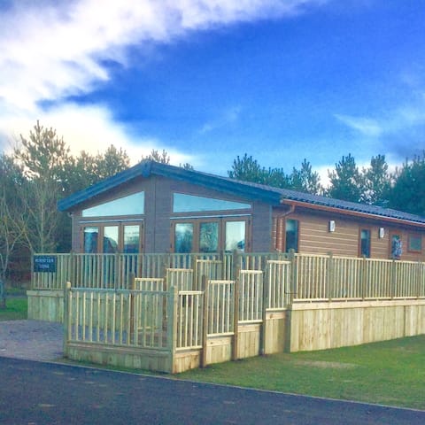 Popular Airbnb listing: Luxury Forest View Lodge with private Hot Tub in Thirston