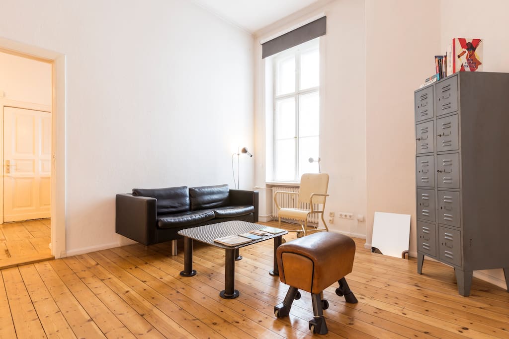 There i a pommel horse with adjustable height, and the chair is an original German dentist chair from the 1920's. Don't be (too) scared :) On the 100KG steel coffee table, you will also find a few original guides of Berlin.