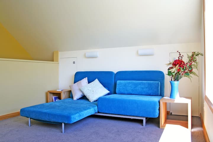 Sofa bed, upstairs. Can be twin or double. This can be a second lounge area or a sleeping space for extra guests. Beautiful view to mountains.