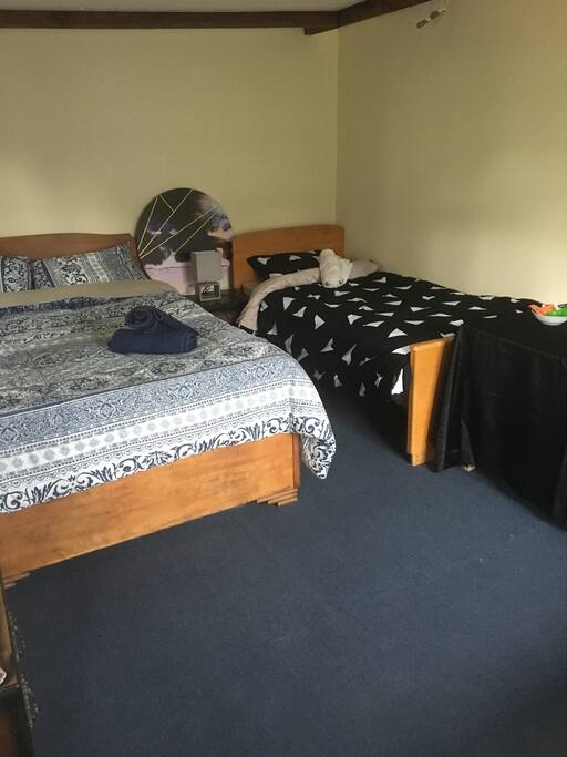 The sleepout which is the bedroom, it has a double bed and two singles.