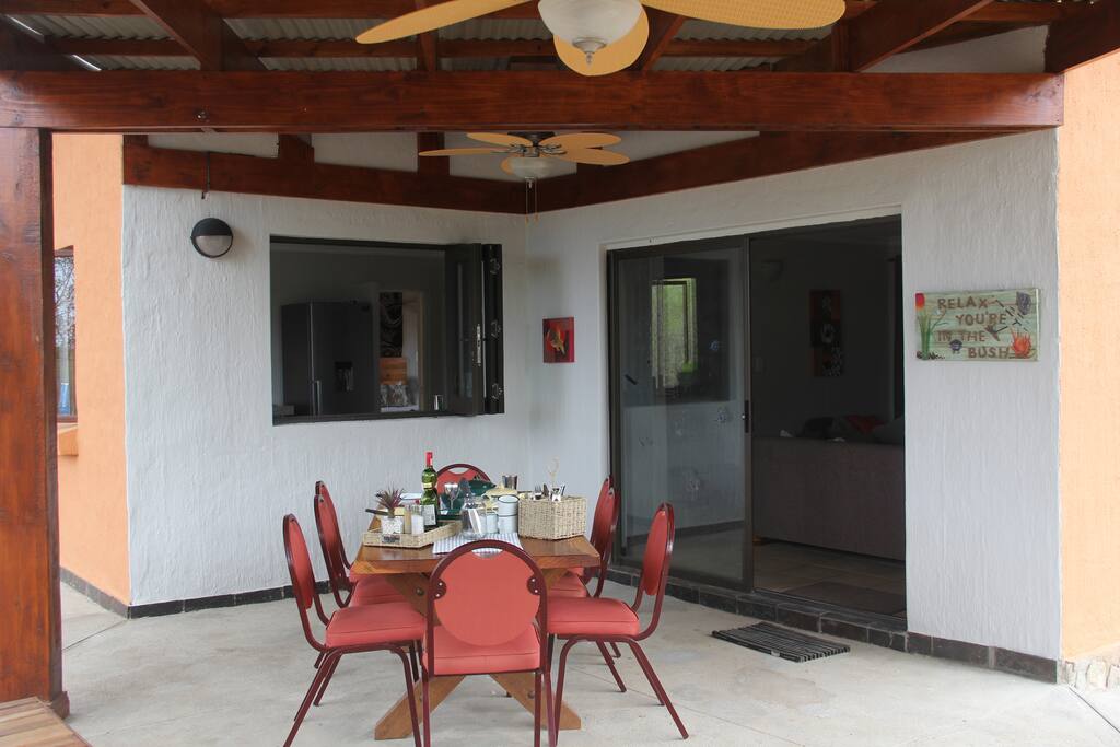 Outdoor dining area with hatch to kitchen