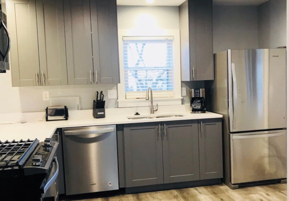 Completely remodeled kitchen with quartz countertops, stainless appliances and new cabinets!