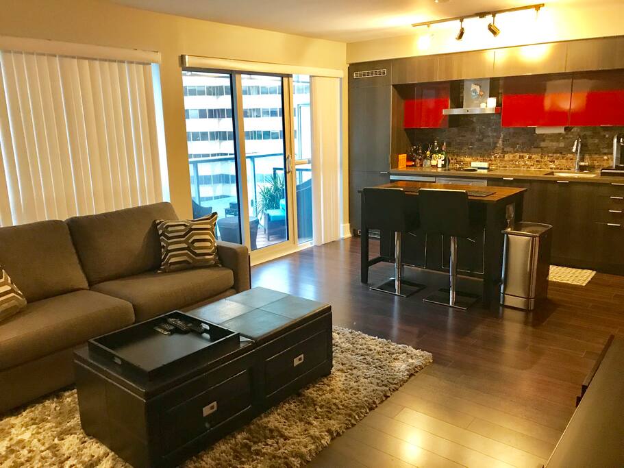 Living room with one sofa and two ottomans